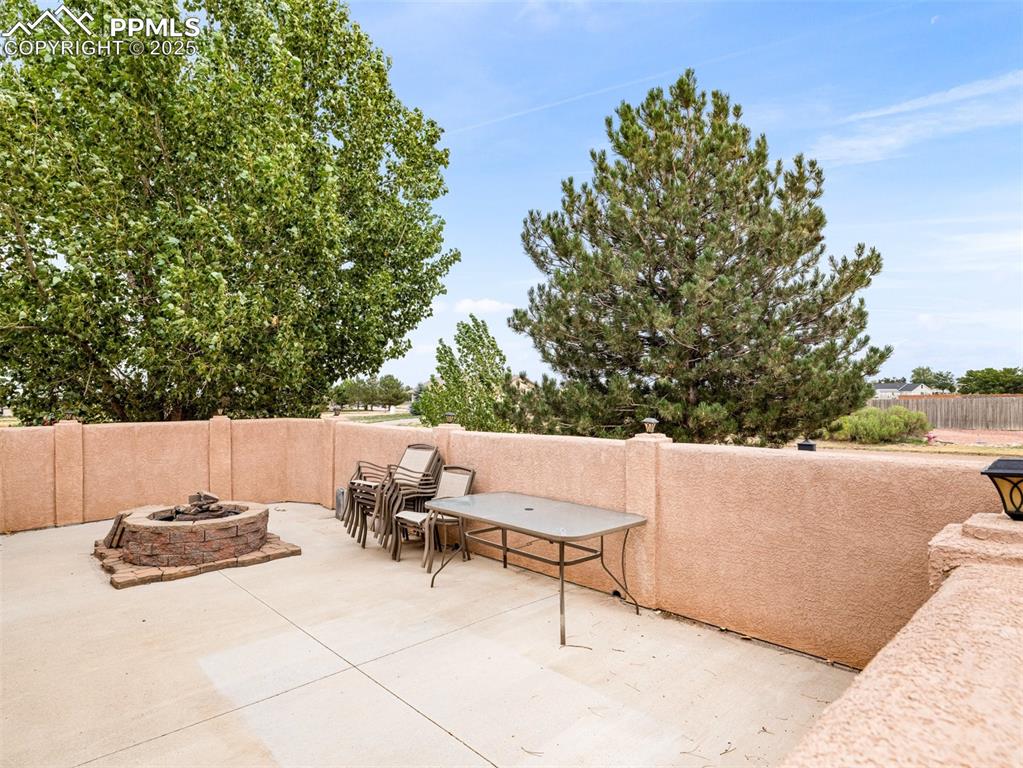Image 43 of 46: View of patio / terrace with an outdoor fire pit