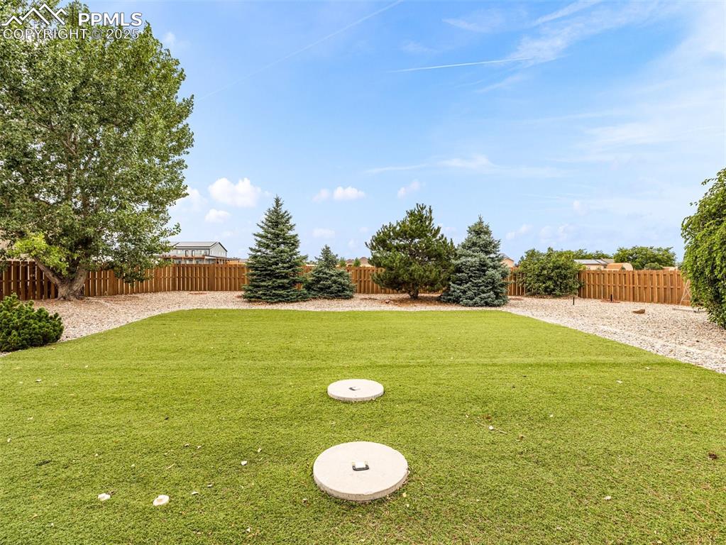 Image 46 of 46: View of fenced backyard