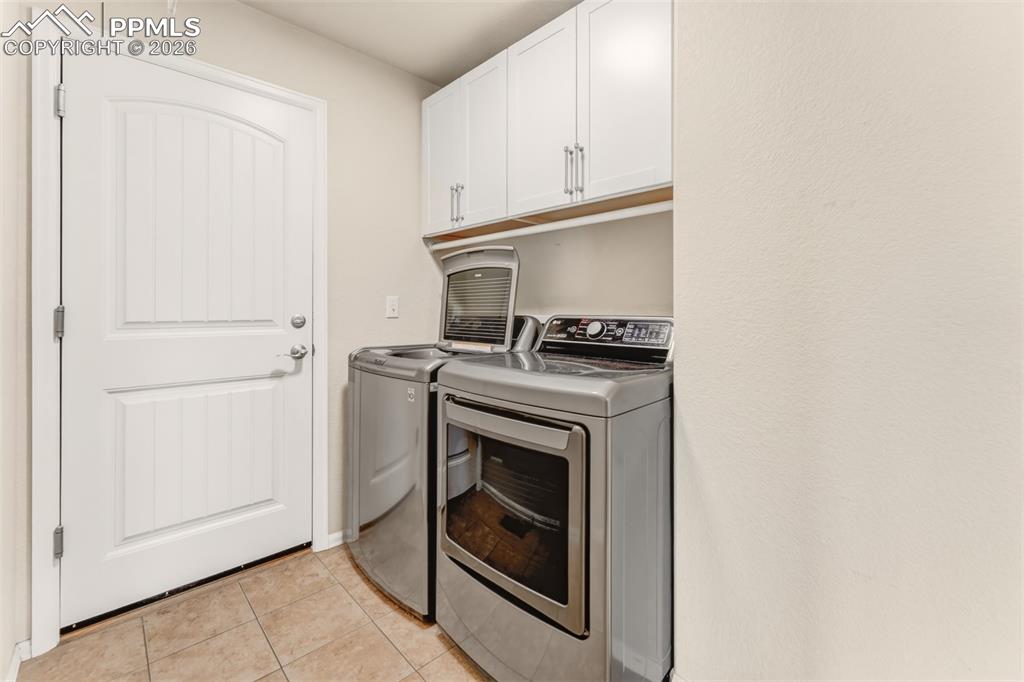 Image 19 of 35: Laundry/mud room off the garage.