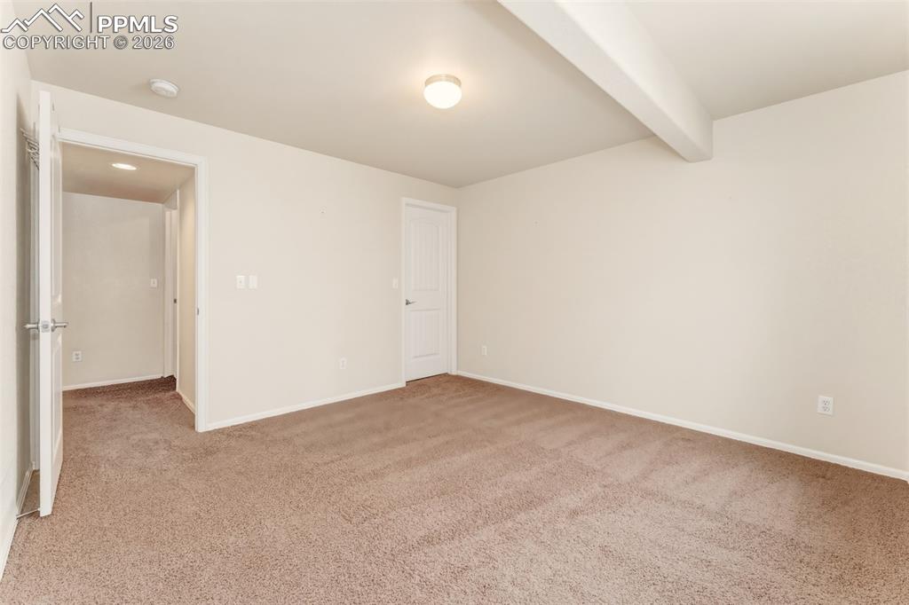 Image 28 of 35: Bedroom #3 in basement near storage room.