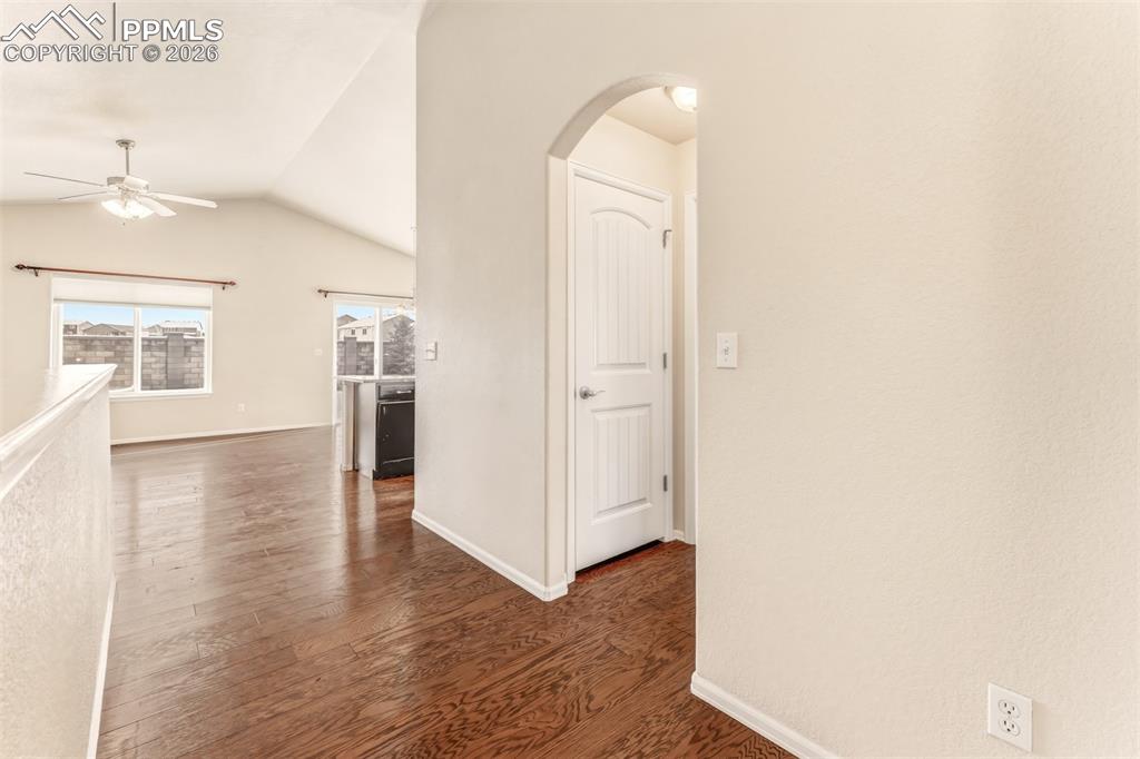 Image 5 of 35: Entry looking towards entertainment area and hallway to second bedroom and 