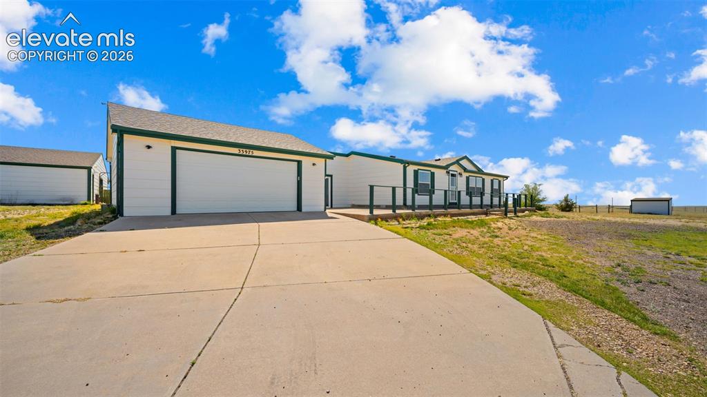 Image 1 of 40: White exterior with dark green trim and shutters