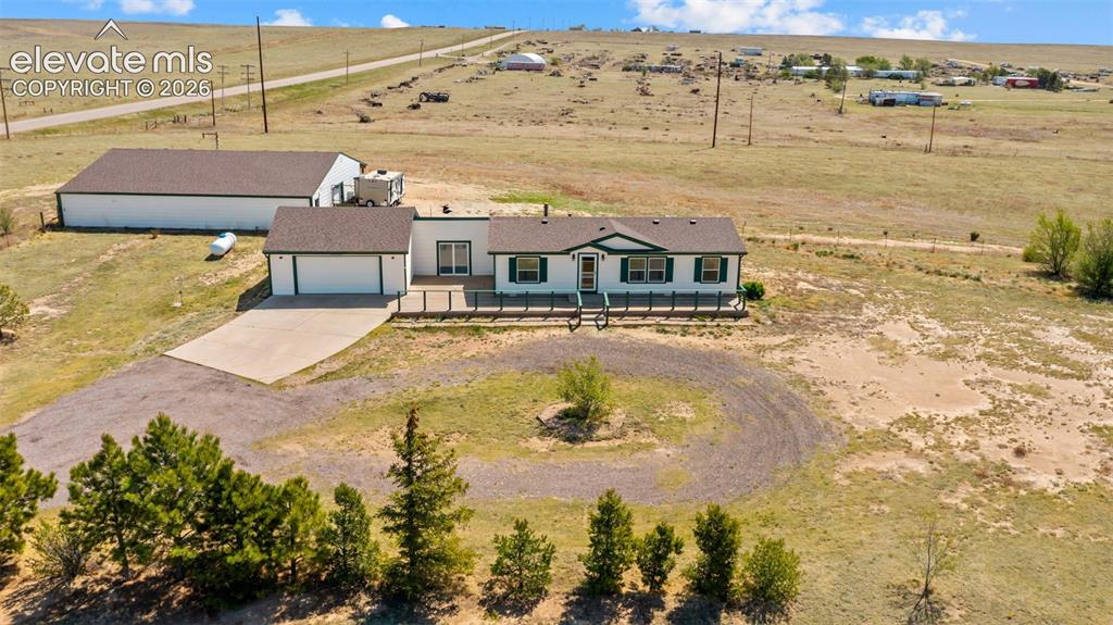 Image 27 of 40: Ranch-style residence featuring an attached two-car garage, a substantial d