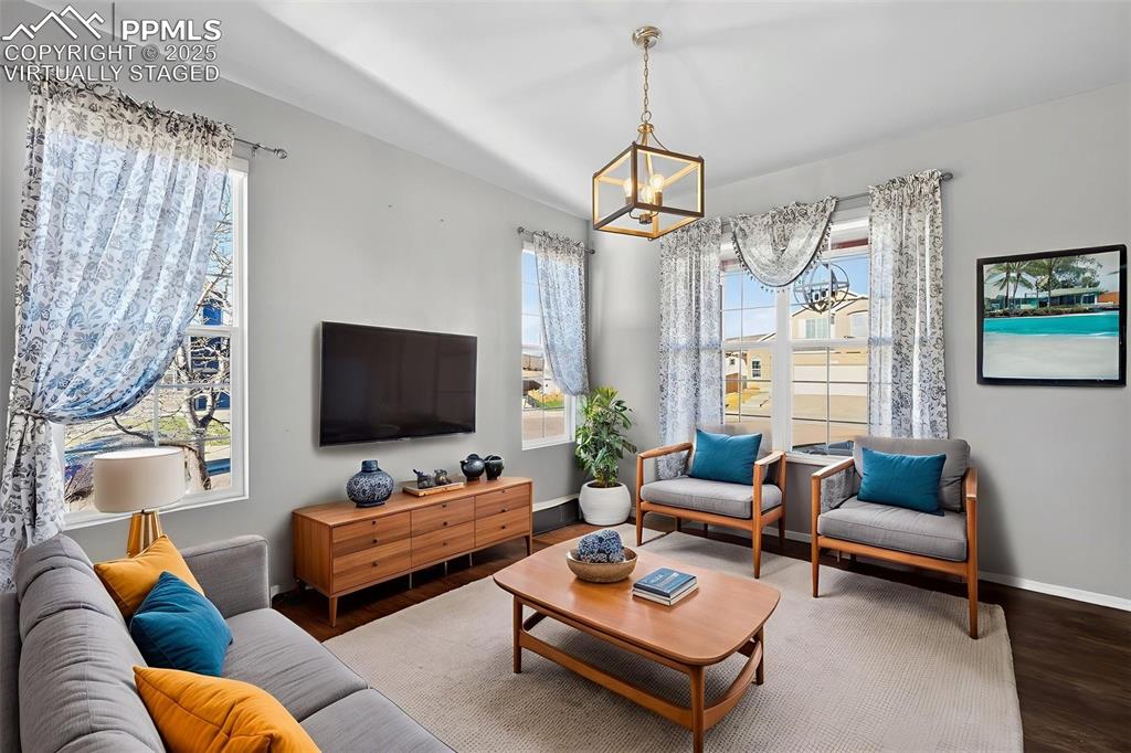 Image 22 of 50: Virtually staged. Seperate dining room or formal living room.