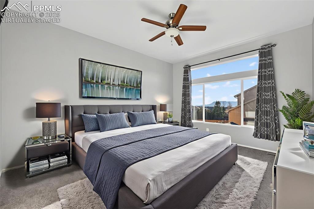 Image 27 of 50: Virtually staged master bedroom.