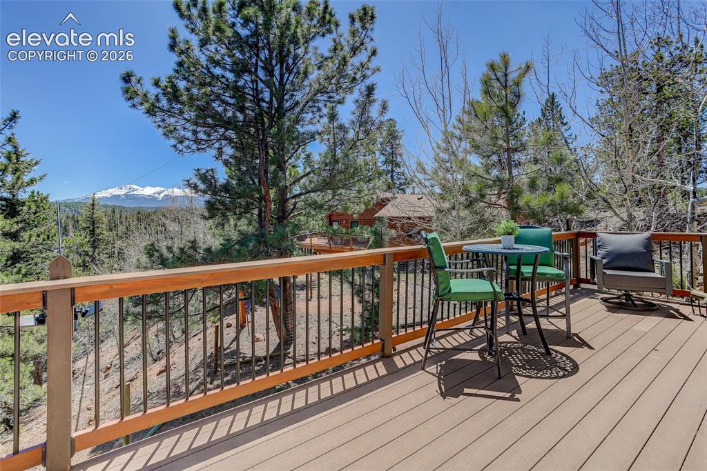 Image 9 of 28: Back deck with views to Pikes Peak
