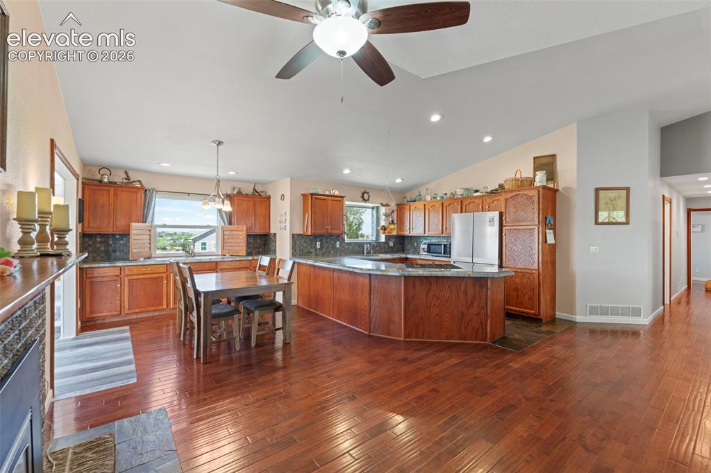 Image 6 of 50: Kitchen and dining area