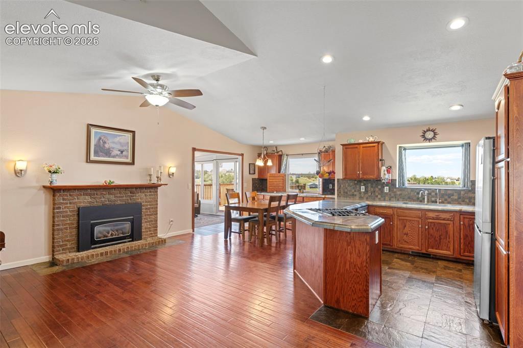 Image 8 of 50: Kitchen with fireplace