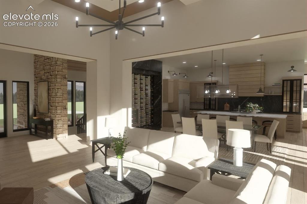Image 11 of 24: Spacious interior featuring high ceilings, wood-finish flooring and built-i