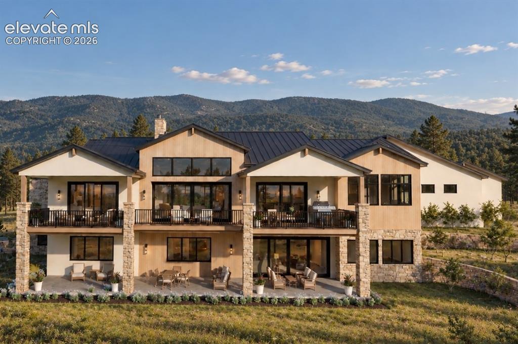 Image 2 of 24: Multi-level rear facade featuring extensive fenestration, multiple balconie