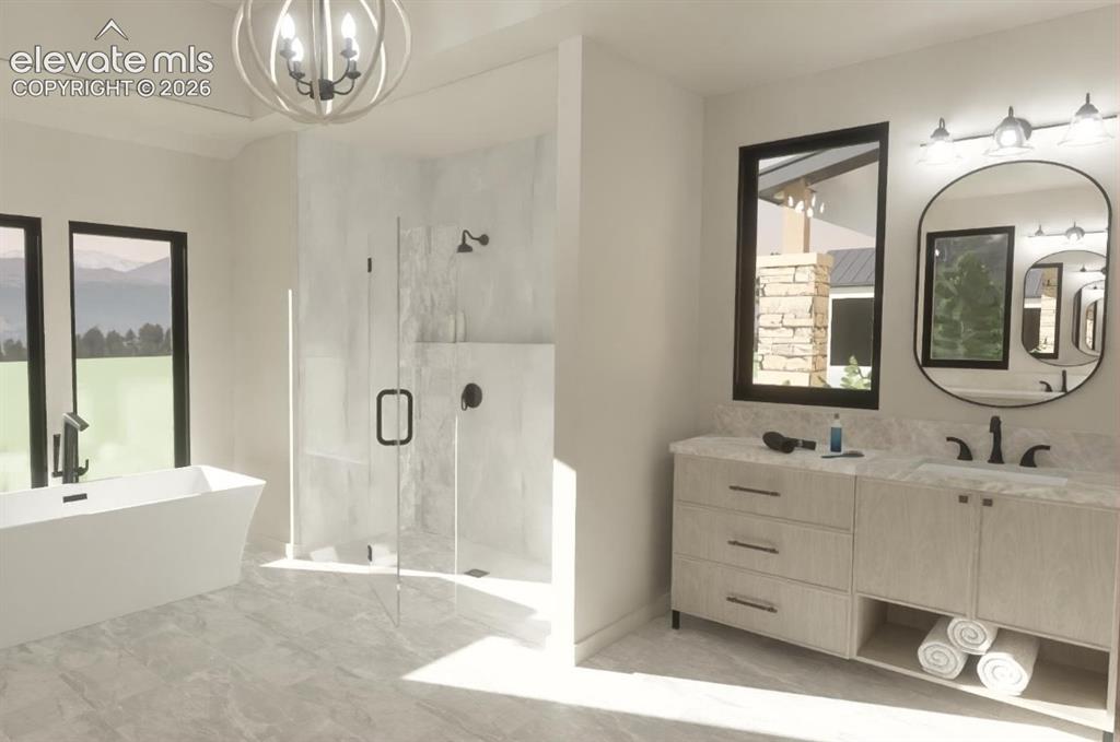 Image 22 of 24: Freestanding soaking tub with a floor-mounted faucet, walk-in shower with c