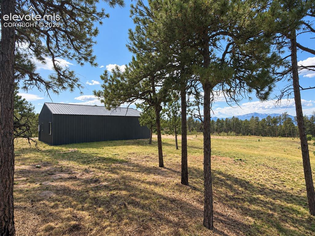 Image 5 of 24: Existing outbuilding can be used as a barn, workshop, or 4 car garage.