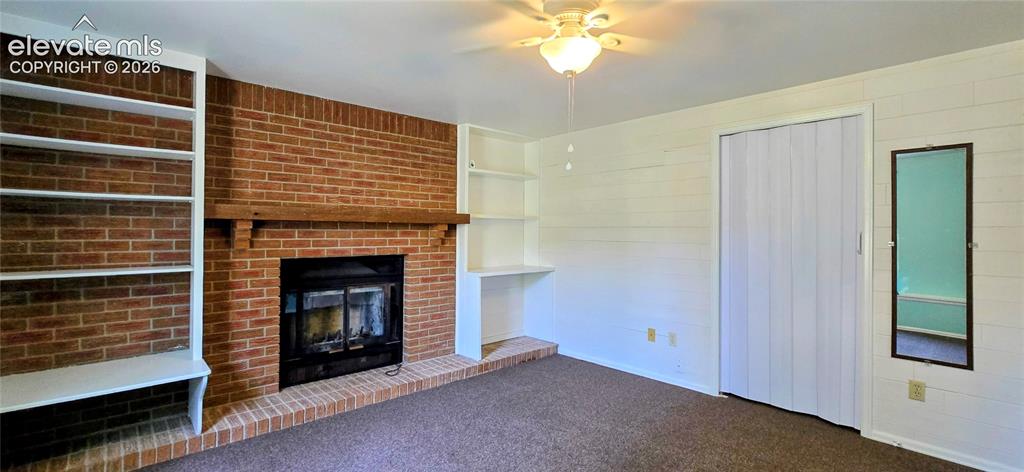 Image 4 of 17: Garage level bedroom with fireplace