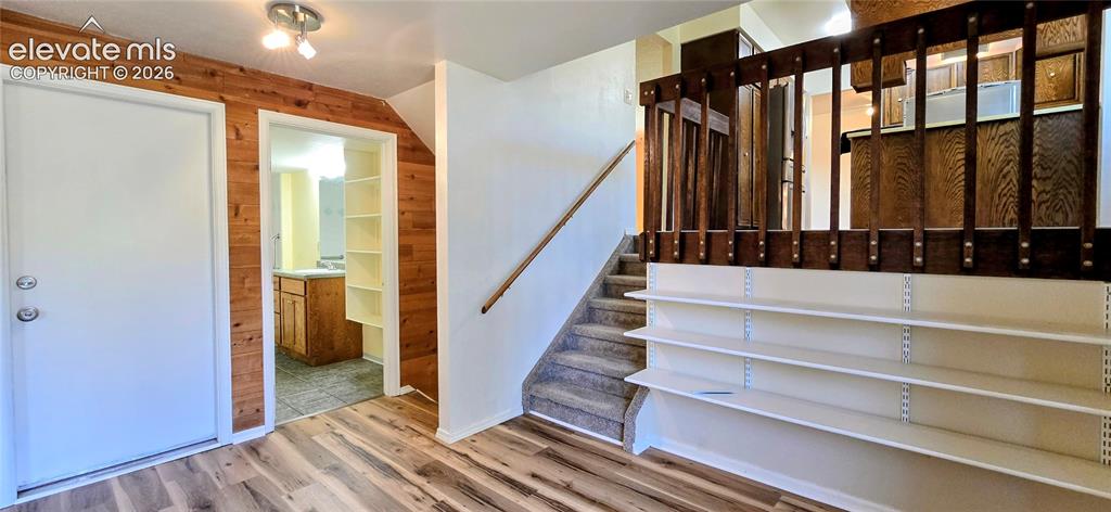 Image 7 of 17: Garage level famil room, bathroom with ADA accessories.