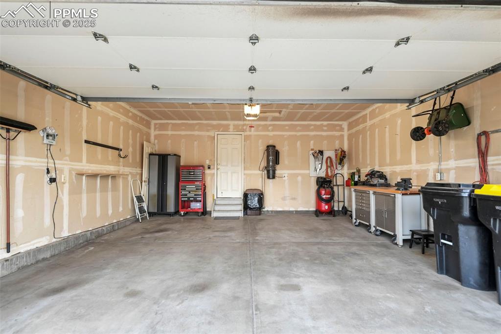 Image 29 of 32: Garage featuring a central vacuum unit
