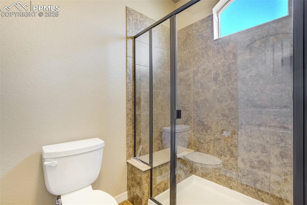Image 16 of 36: Full bath with a stall shower