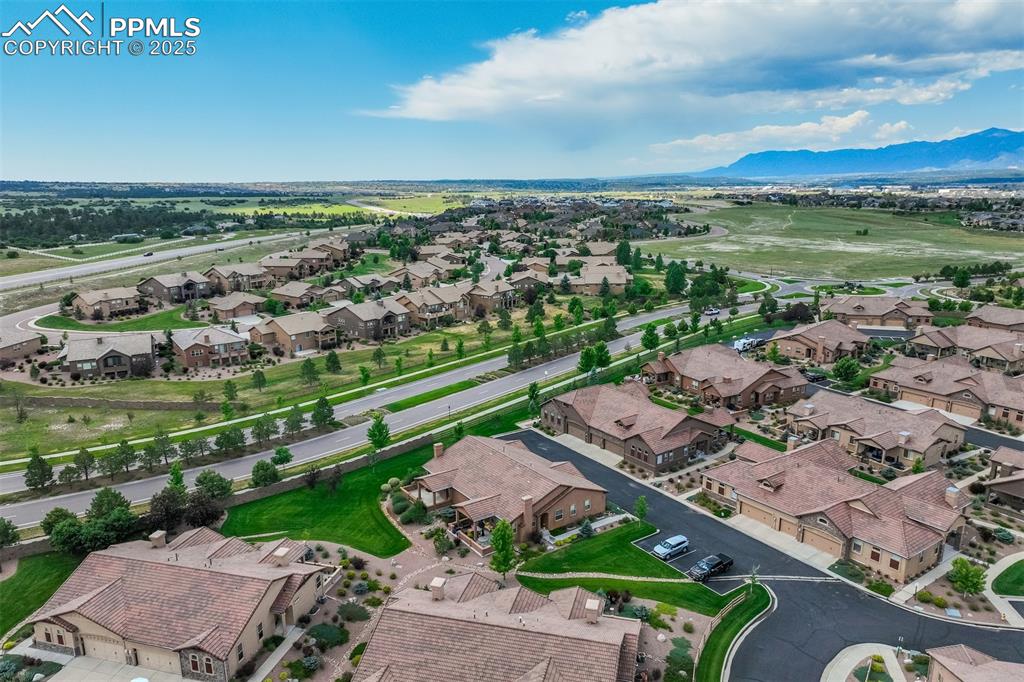 Image 31 of 36: Aerial perspective of suburban area with mountains