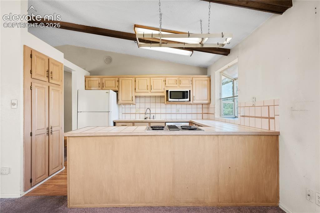 Image 10 of 38: Kitchen