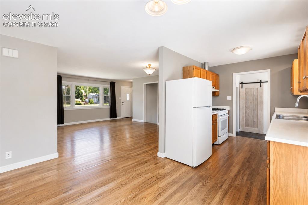 Image 10 of 26: Family Room with woodburning fireplace.