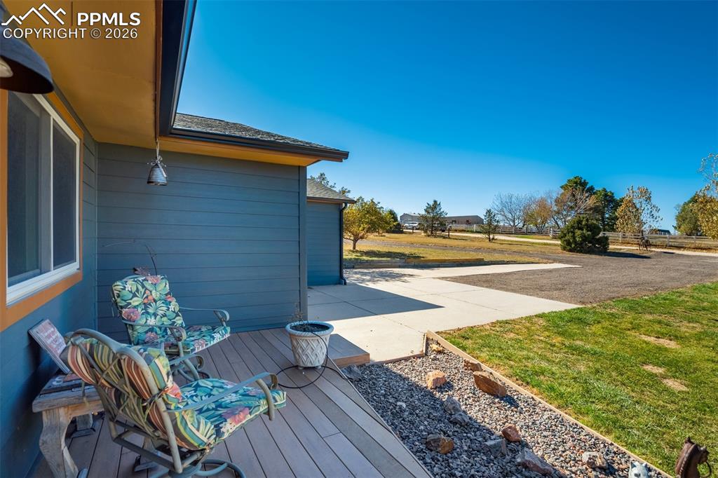Image 6 of 50: View of patio / terrace with a deck