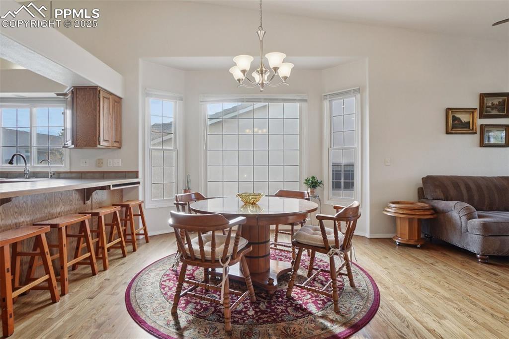 Image 10 of 42: Dining area adjacent to kitchen and breakfast bar.