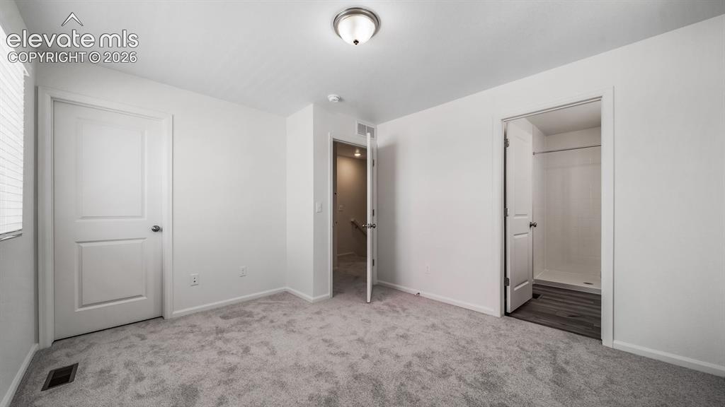 Image 20 of 24: Light gray carpeting with white walls and trim
*Photos of a model home*