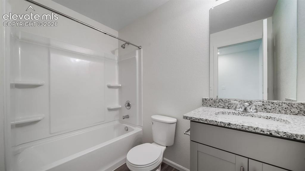 Image 7 of 24: Full bathroom featuring a tub/shower combination with a white surround, a s