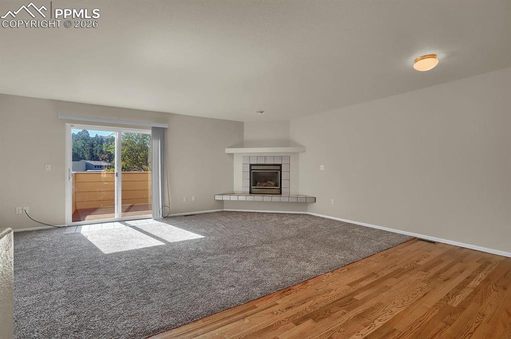 Image 5 of 26: This room is now all hardwood. 