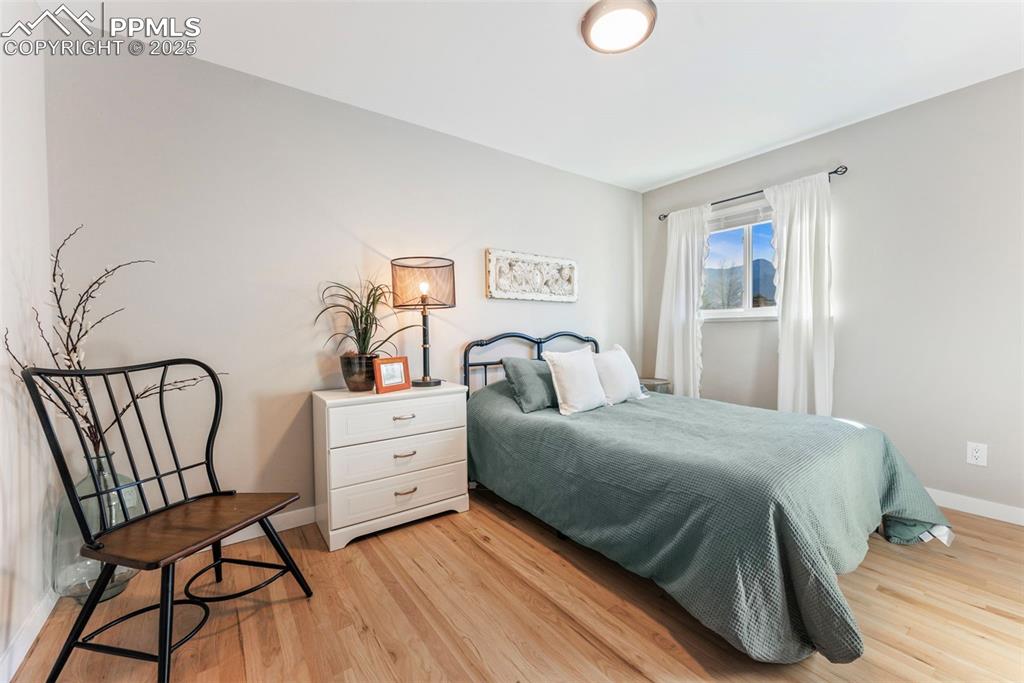 Image 18 of 45: Bedroom featuring light wood-type flooring