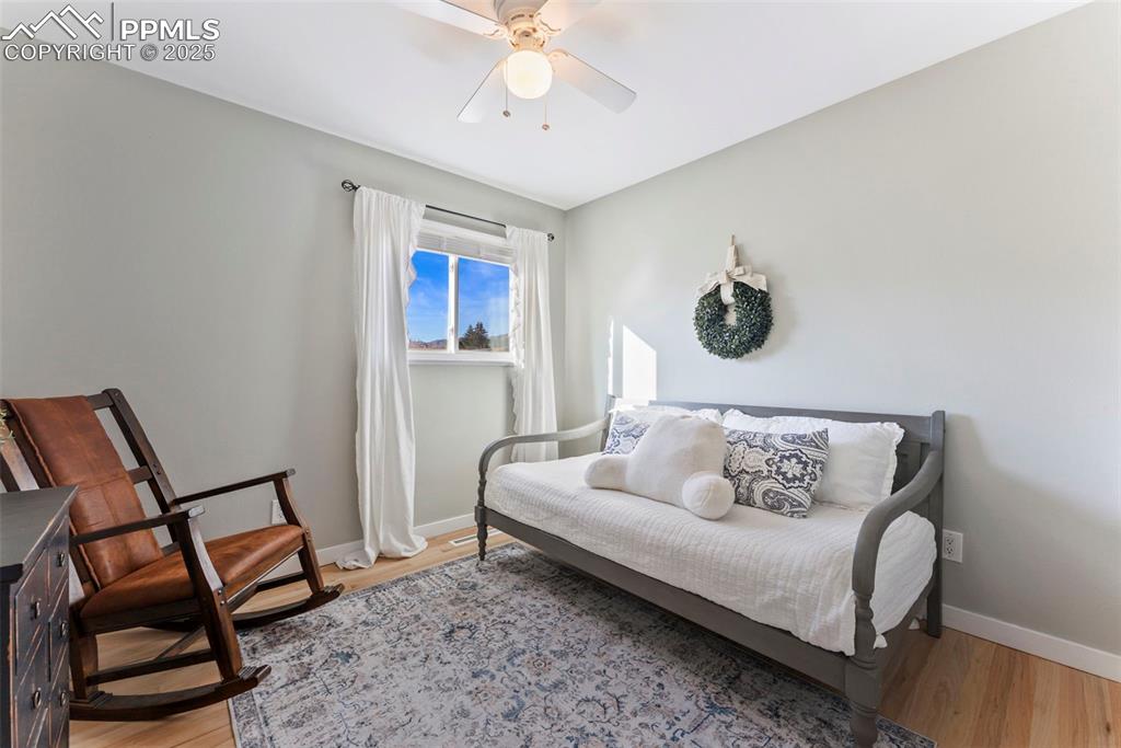 Image 20 of 45: Bedroom featuring light wood-style flooring and a ceiling fan