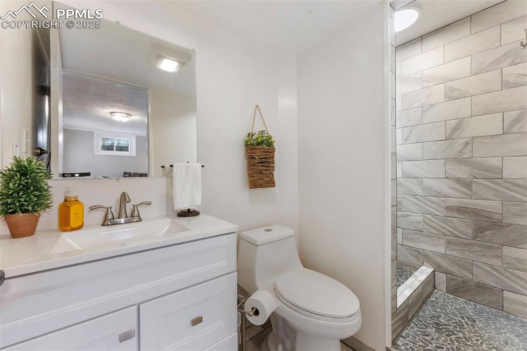 Image 24 of 45: Full bath with vanity and walk in shower