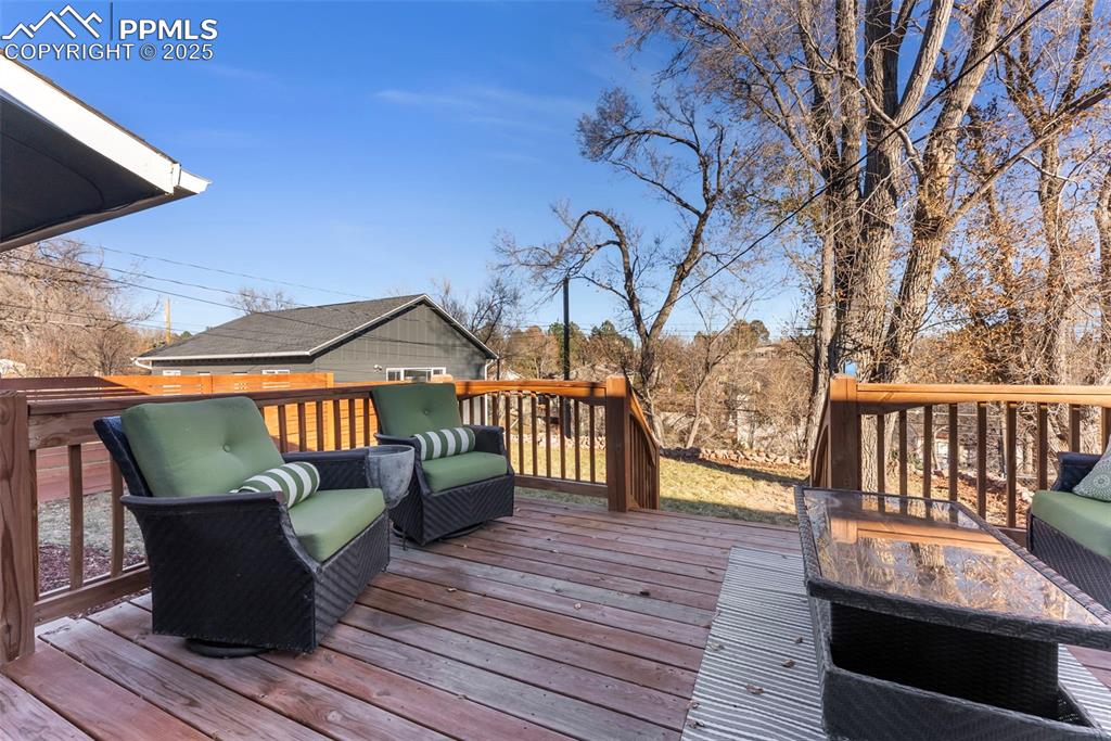 Image 34 of 45: Wooden deck with grilling area