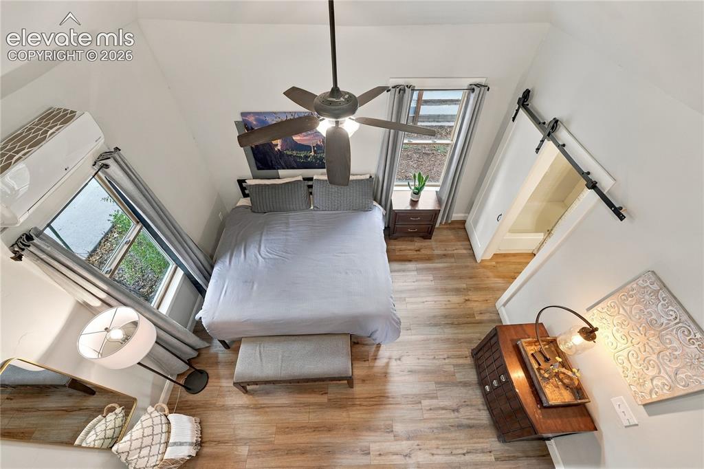Image 44 of 50: View from the loft into the bedroom. 