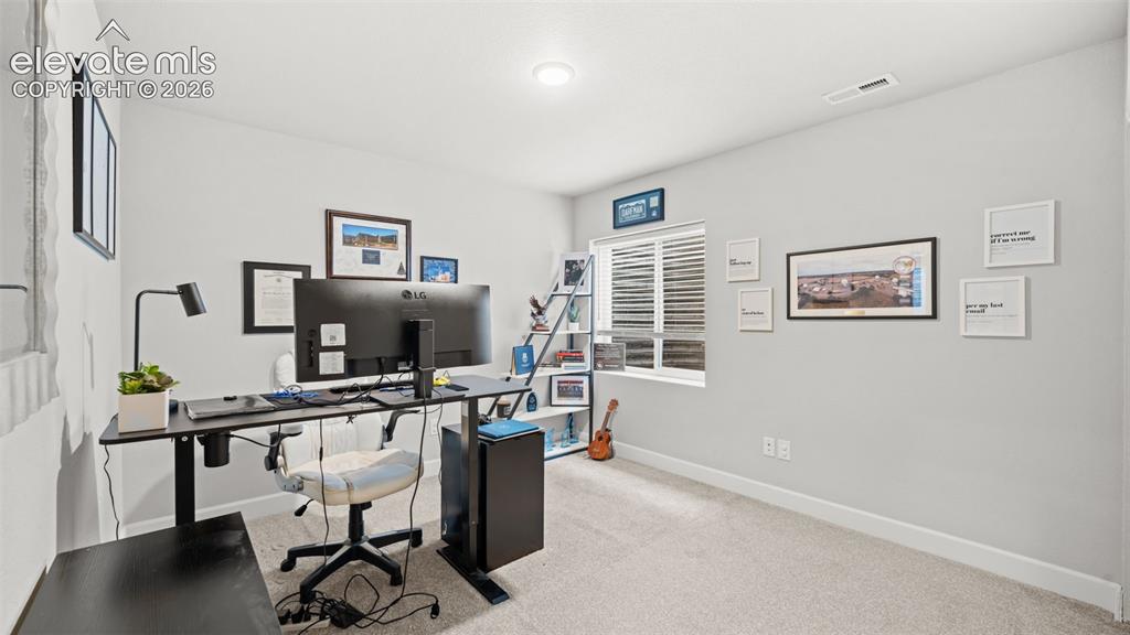 Image 22 of 34: Flexible room featuring neutral-toned walls, recessed lighting, white baseb