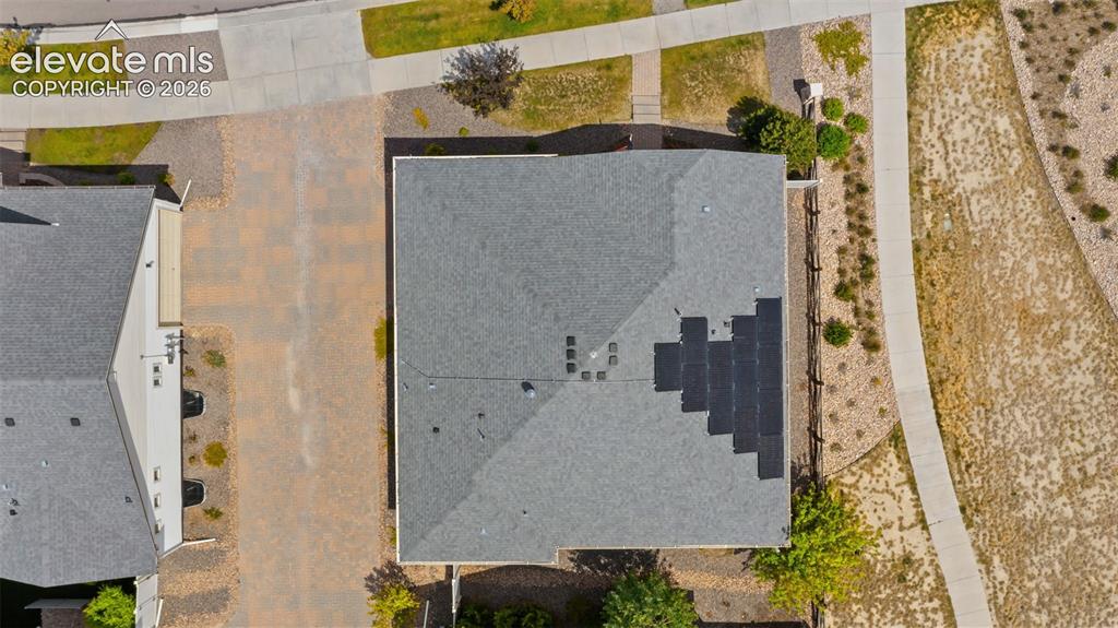 Image 34 of 34: Asphalt shingle roofing with installed solar panels