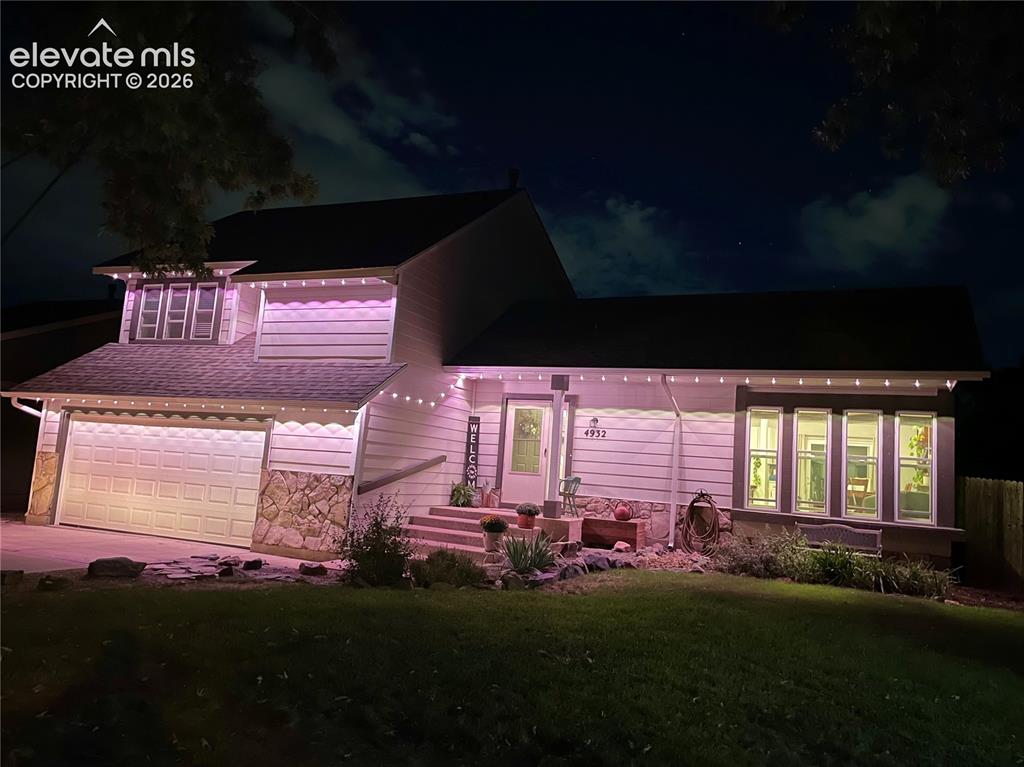 Image 41 of 45: Front of Home during Twilight Hours