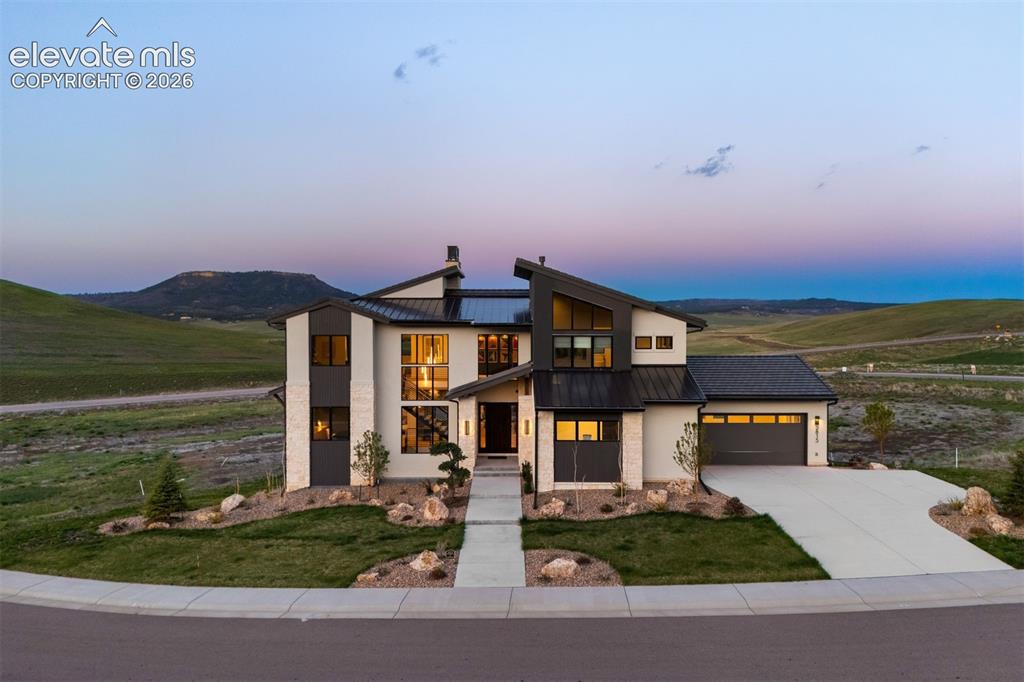Caption: Contemporary exterior set against open space and Dawson Butte views.