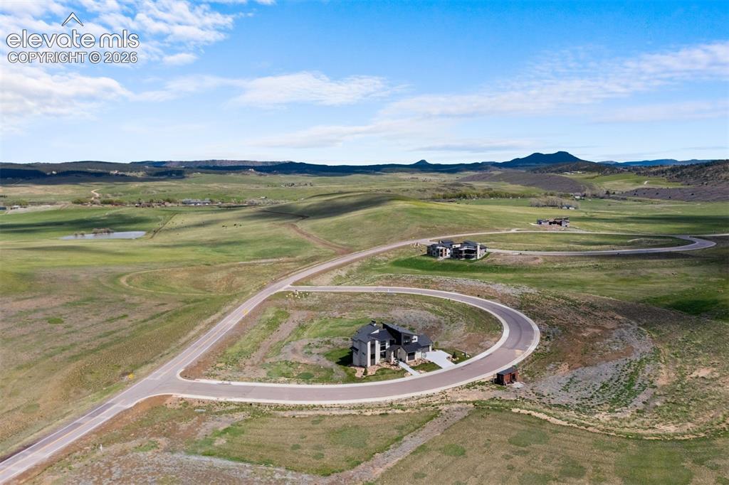 Image 36 of 38: Aerial perspective highlighting the home’s expansive setting and surroundin