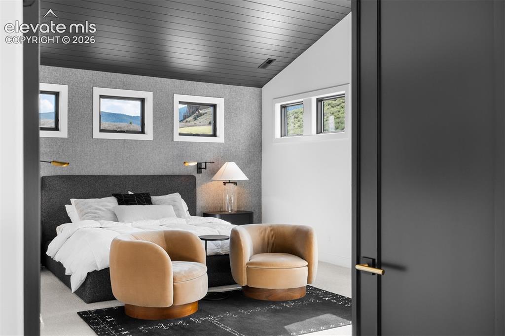 Image 9 of 38: Primary bedroom with curated finishes and natural light.