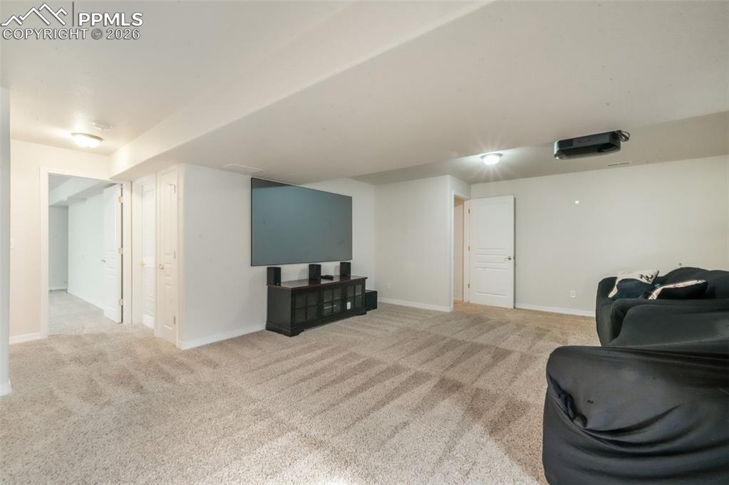 Image 37 of 50: Carpeted spare room with baseboards