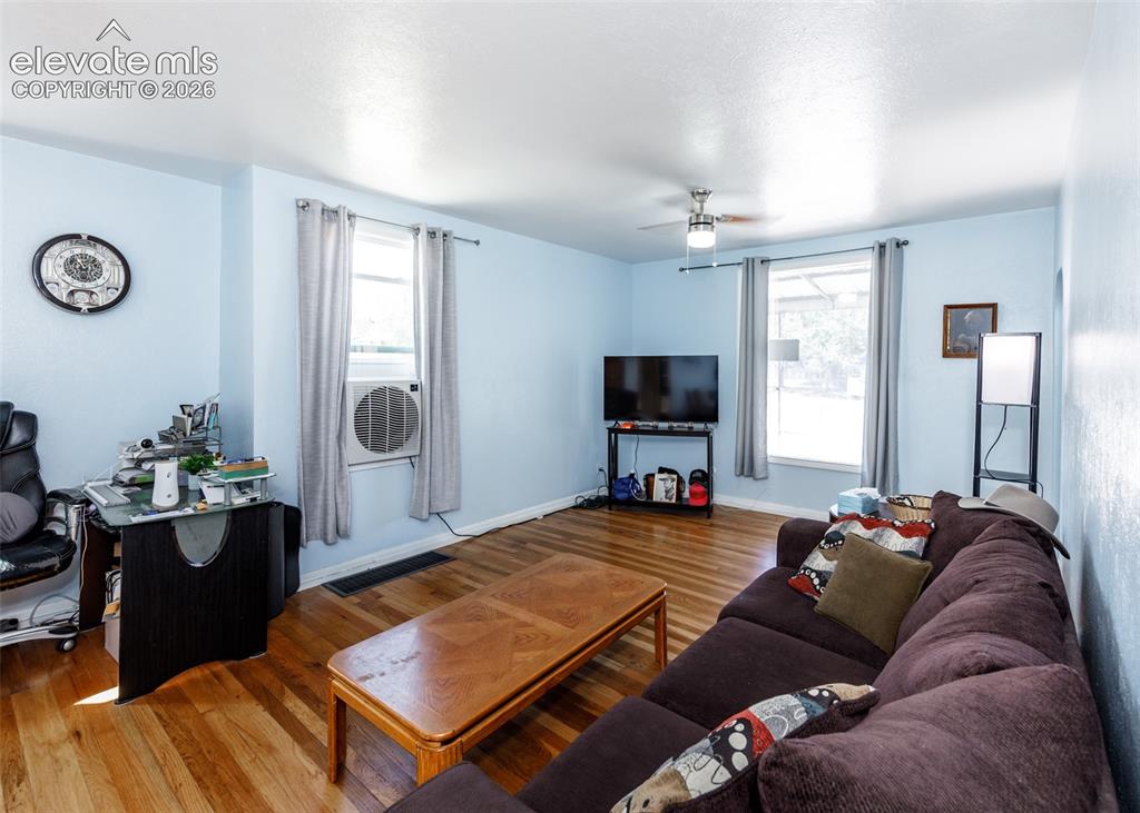 Image 2 of 25: Wood-finish flooring throughout the space