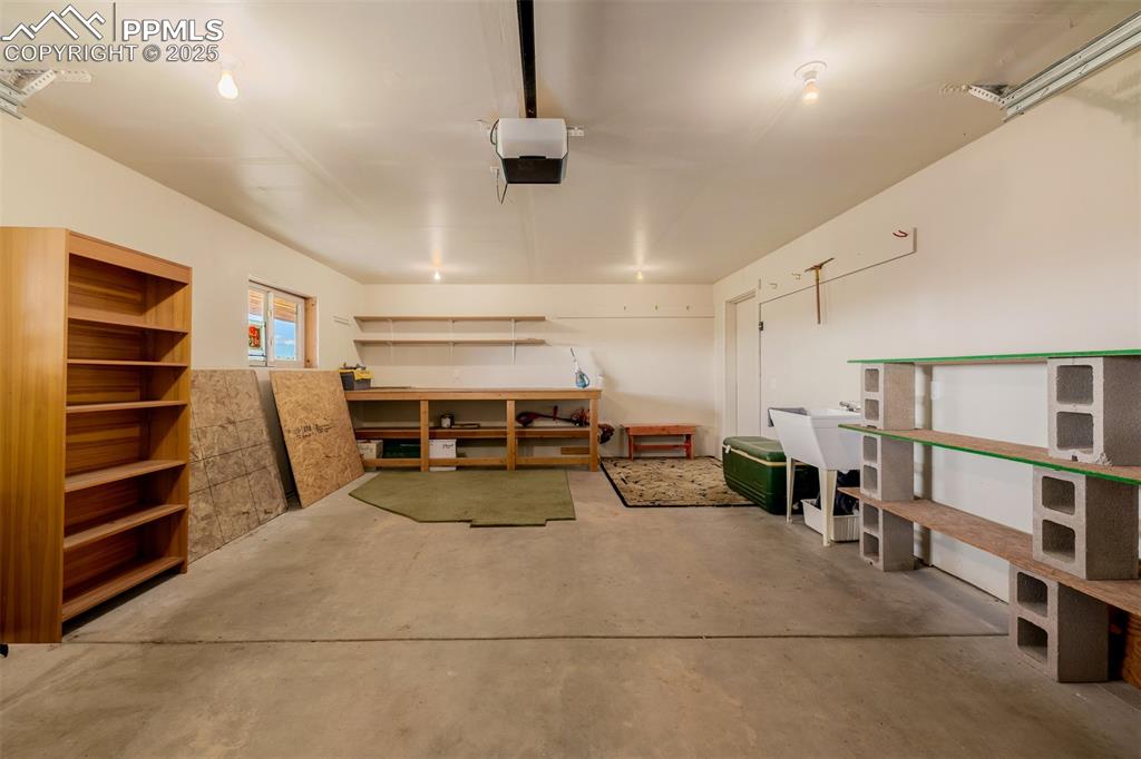 Image 27 of 48: Garage with a garage door opener