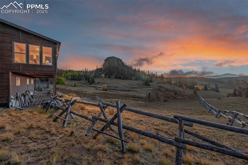 Image 33 of 48: View of yard at dusk