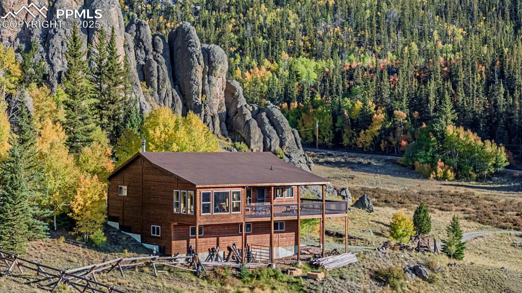 Image 36 of 48: View of subject property featuring a heavily wooded area