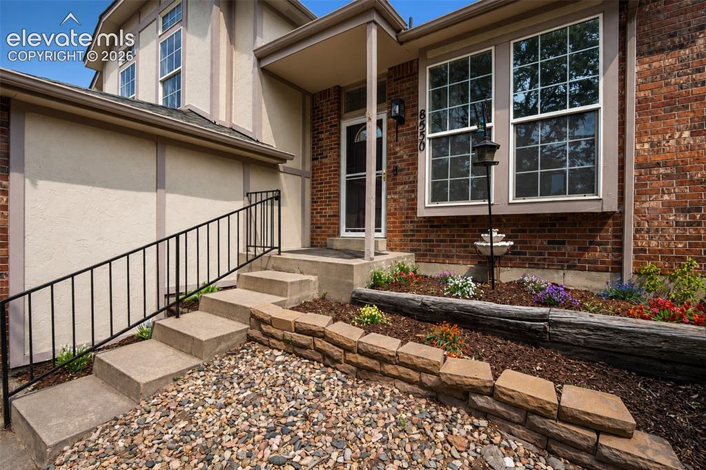 Image 10 of 35: Front Entry with Garden Area.