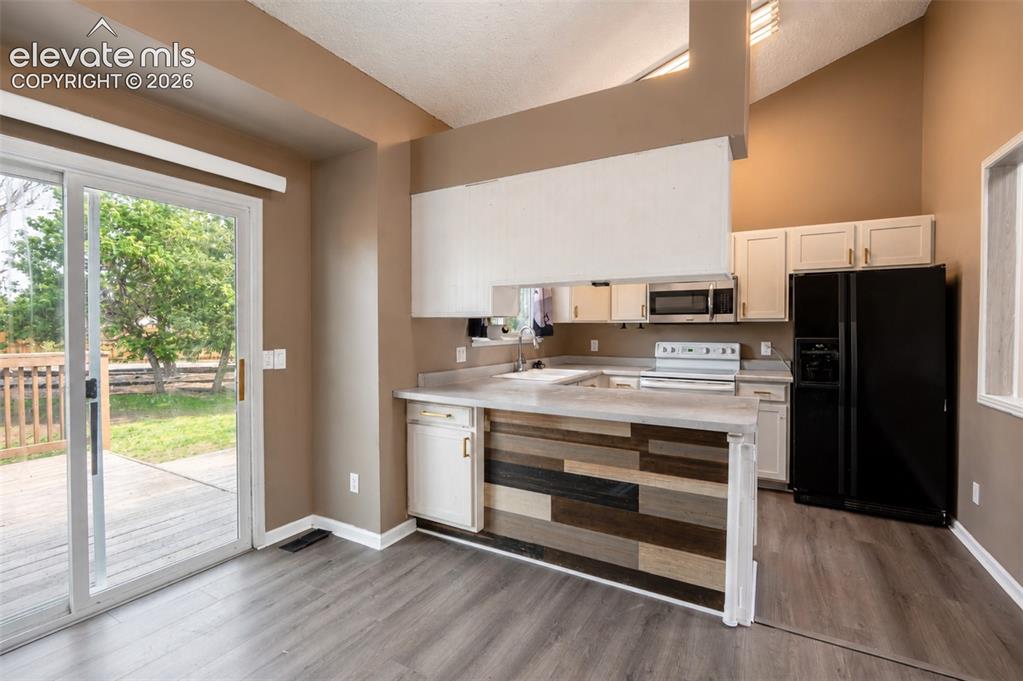Image 16 of 35: Dining Room to Kitchen.