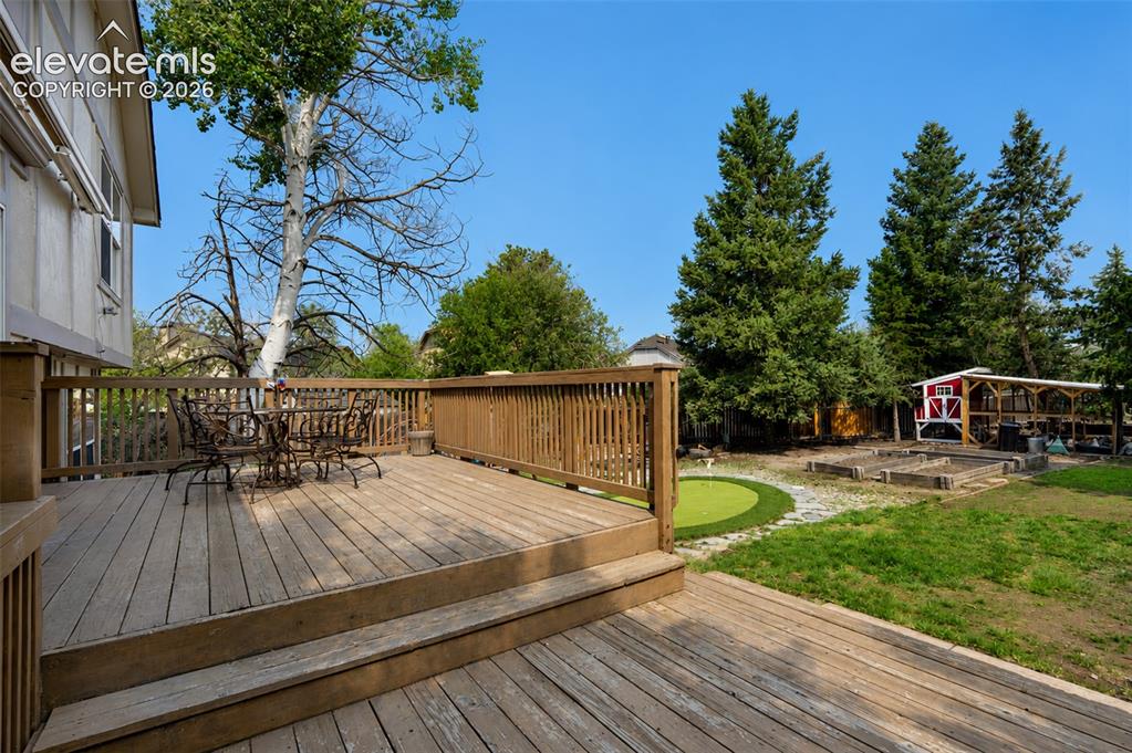 Image 4 of 35: Deck with view to backyard