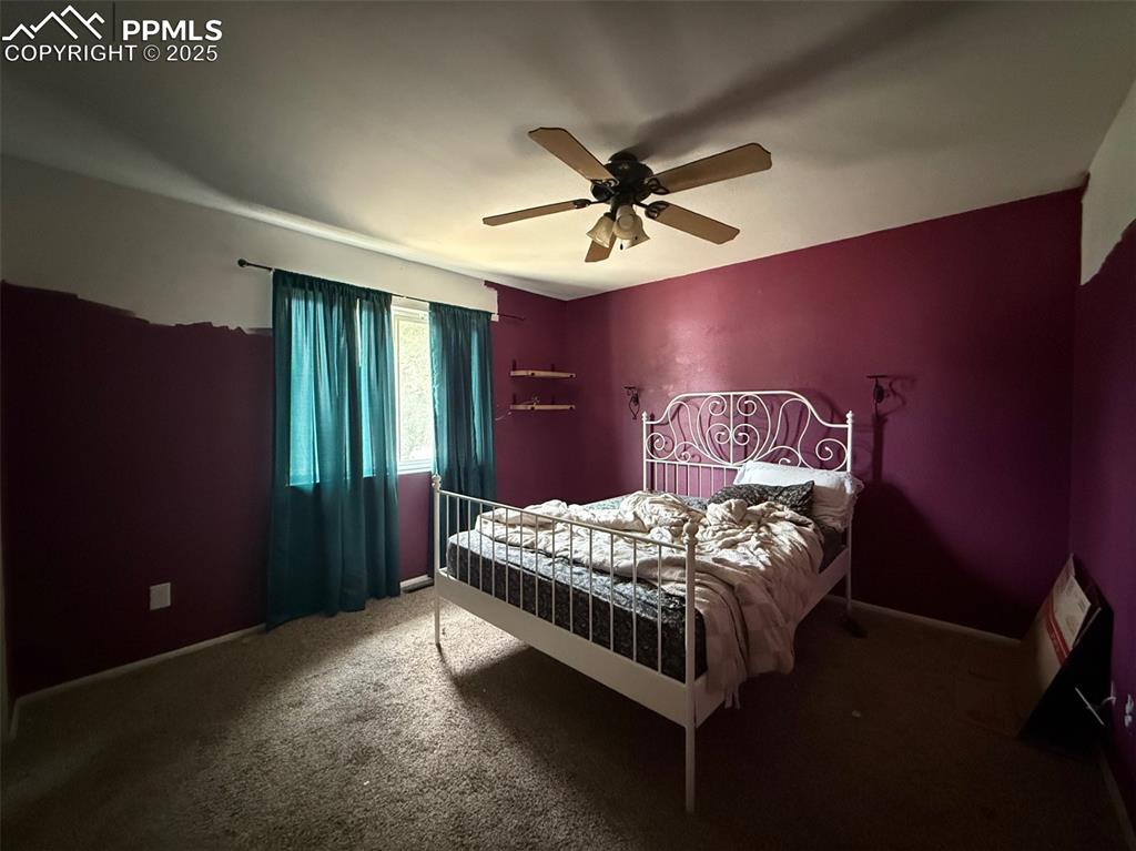 Image 6 of 10: Bedroom with carpet and ceiling fan