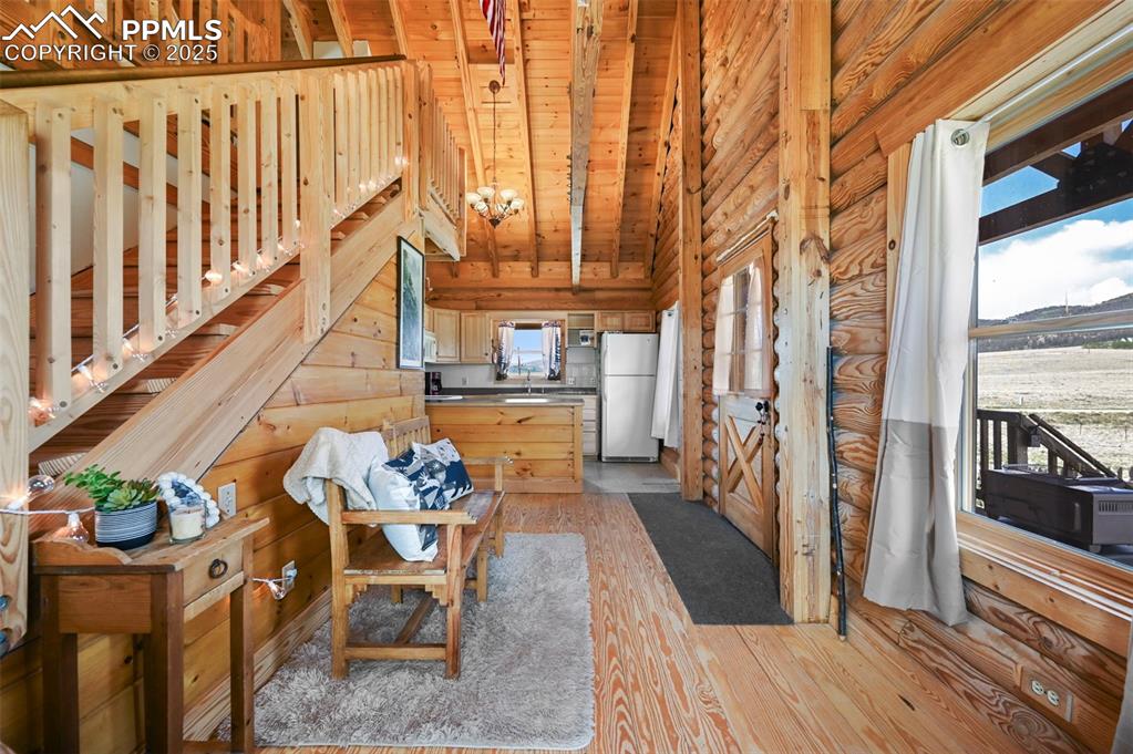 Image 4 of 35: Living area with healthy amount of natural light, light wood-style floors, 