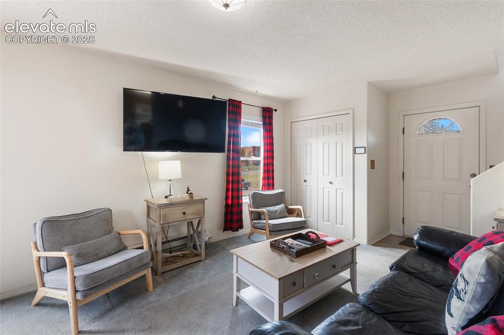Image 14 of 36: Living space all on the main levels. Upper level bedrooms are quiet and pri